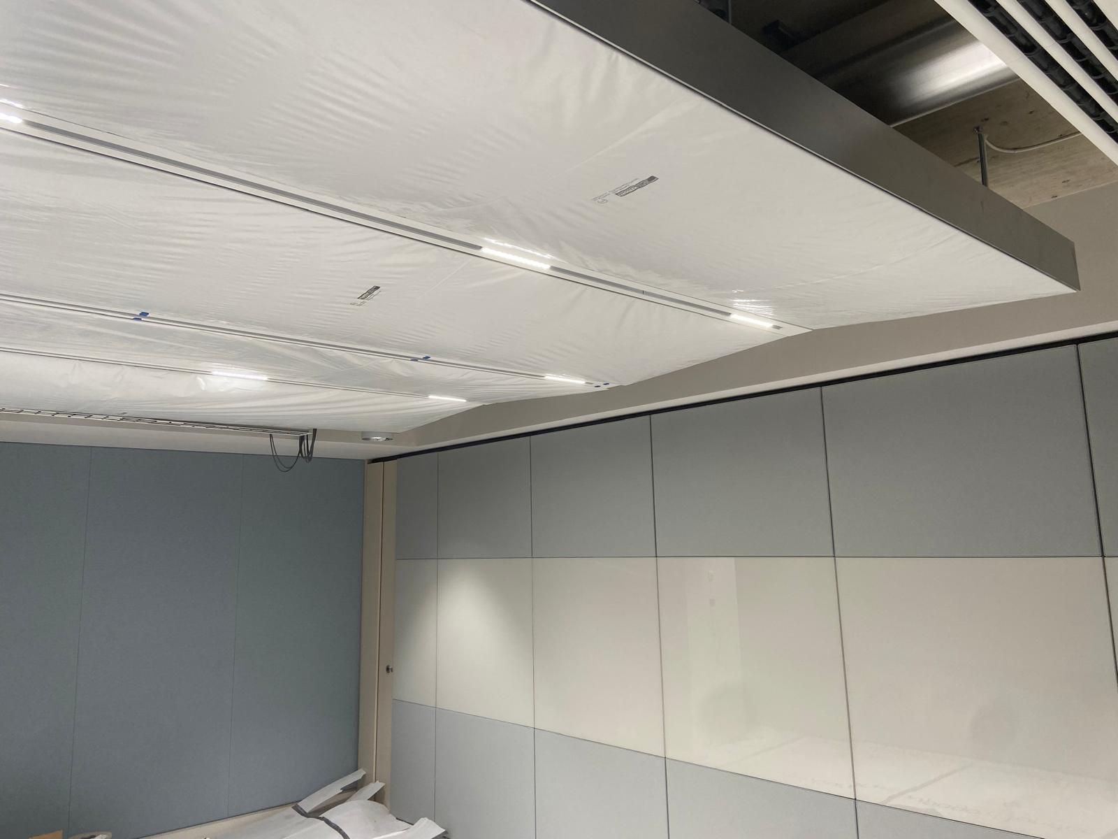 On-site view of the SEAM linear channel and integrated lighting during fit-out at BW New HQ