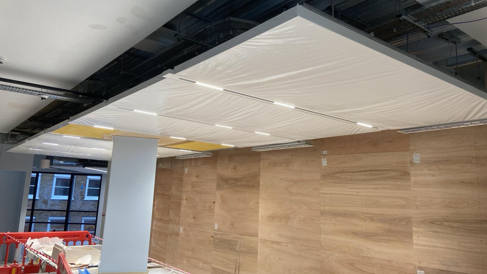 Suspended ceiling bay under construction at BW New HQ with SEAM channels housing linear lighting