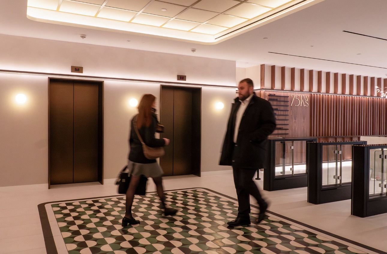75 KWS reception lift lobby with bespoke RAL 8000 ceiling grid and Artworks PET panels